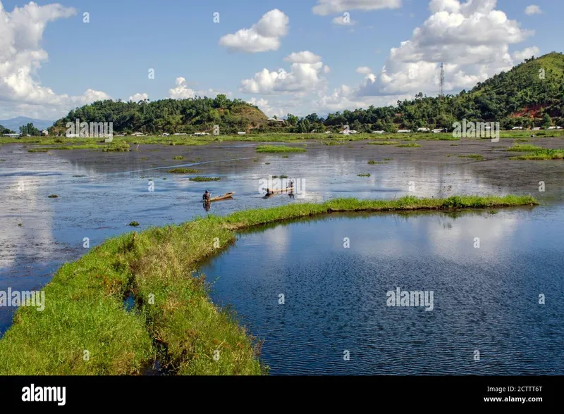 Image Imphal - Loktak Lake image beautiful image beautiful - Two fishermen are sailing through the beautiful Loktak Lake ...